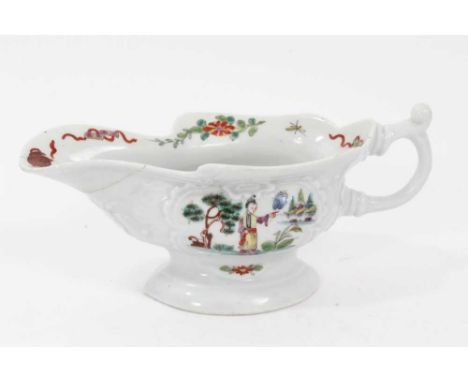 Worcester sauceboat, c.1755, of shaped form on a pedestal base, polychrome decorated with Chinese figures within moulded cart