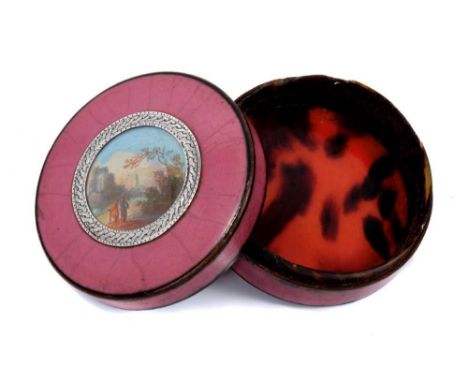 18th century French tortoiseshell snuff box of circular squat form, the top inset with watercolour fantastical landscape scen