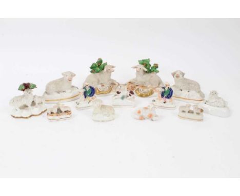 Collection of mostly Victorian Staffordshire sheep figures, together with a pair of Samson sheep and some further animal figu