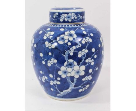 Chinese blue and white porcelain ginger jar and cover, c.1900, decorated with prunus blossom, double-ring mark to base, 25.5c
