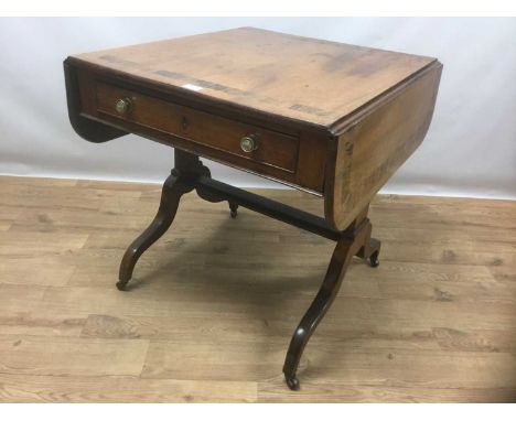 19th century mahogany and rosewood banded sofa table, the hinged rounded rectangular top over a frieze drawer, on downswept l