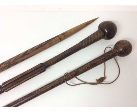 Three Zulu tribal canes, the first with bulbous knop, bound with wire ornament, 84cm long, together with a snake wood cane an