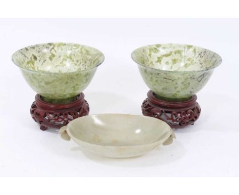 Chinese carved celedon jade dish, of shallow form with twin flanking fruit-form handles and lappet carved bands, 12cm wide, t