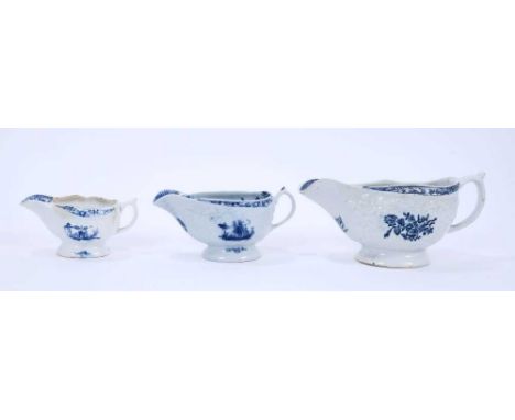 Three Lowestoft sauceboats, the first of large size, moulded in relief with floral panels and printed in blue with floral spr