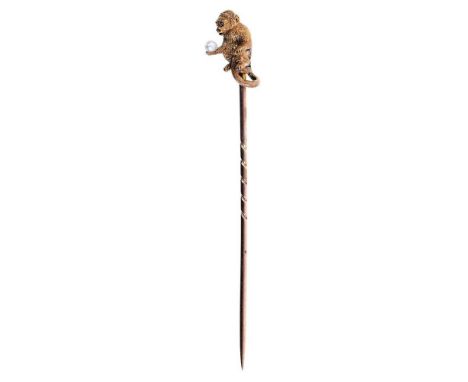 Good quality late Victorian novelty gold stick pin in the form of a monkey holding a pearl ball, finely modelled with texture