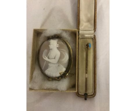 A cased gold and turquoise stick pin and cameo