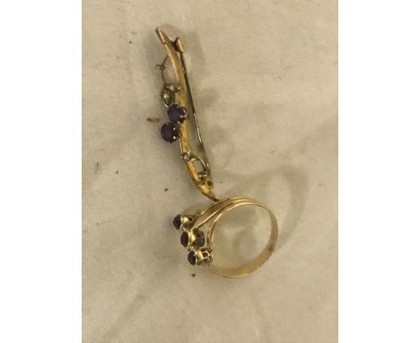 A gold garnet ring, c1940; together with an amethyst and pearl brooch