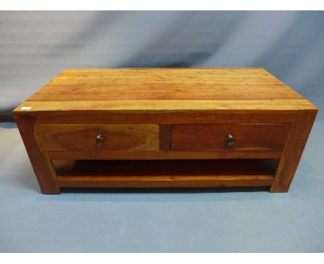 An oak two tiered coffee table, each side having two small drawers, on bracket feet. H-45cm, W-121cm, D-61cm 