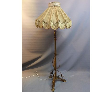 An Arts and Crafts brass and copper standard lamp (with shade)