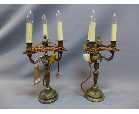 A pair of 19th Century ormolu three branch candelabra with ornate decoration (leather converted to electricity) 