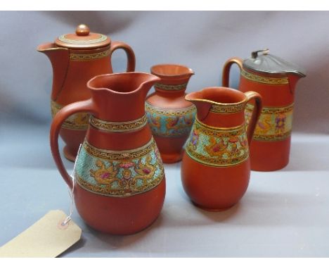 A collection of Prattware terracotta ewers and jars, one with peter lid, with band of enamelled decoration depicting griffins