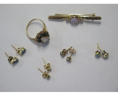 A gold opal ring, surface tests to approx 9ct - ring size P/Q - approx weight 4 grams - one outer stone chipped otherwise goo