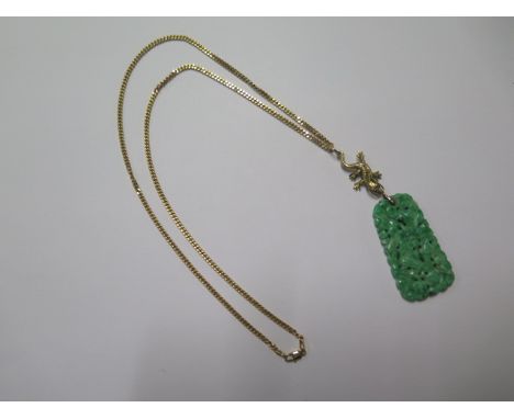 A carved green jade pendant 5cm x 2.5cm on a 9ct yellow gold dragon pendant mount and 9ct gold 56cm chain - total weight appr