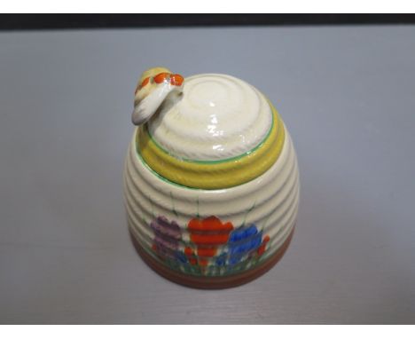 A Clarice Cliff Newport Crocus beehive honeypot - height 10cm - some wear to rim otherwise generally good 