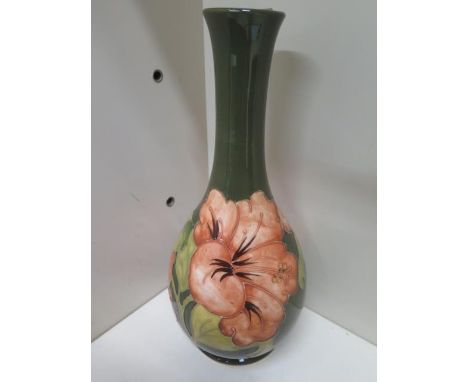 A Moorcroft bottle vase - Height 17cm - some crazing to base, otherwise good 