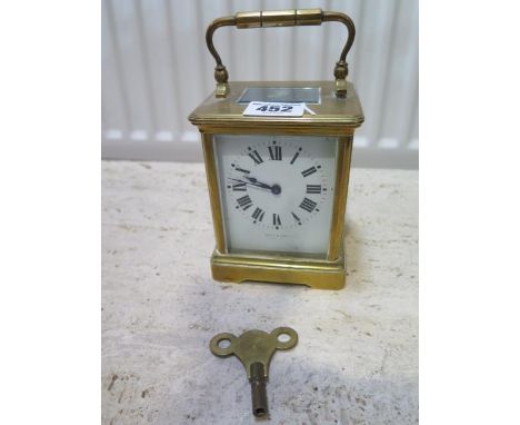 A brass carriage clock the dial signed Ross &amp; Son - working with key 