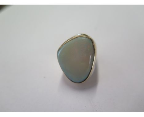 A gilt metal opal ring size H/I - head approx 25mm x 20mm - surface tests to approx 9ct gold - weight approx 14.4 grams - sma