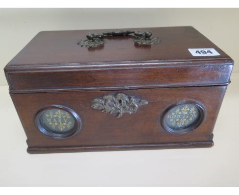 A Georgian mahogany tea caddy with a brass handle in good condition, missing interior mixing bowls - Width 26cm x Height 14cm