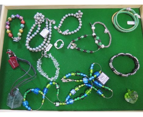 An assortment of costume jewellery to include bracelets/pendant/ring - ex jewellers stock - as new condition 