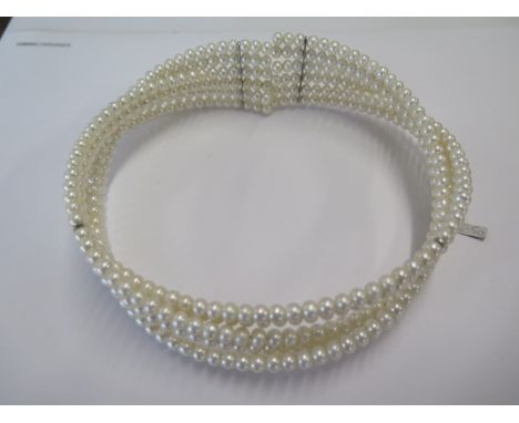 A rigid 6 strand pearl choker sprung - ex jewellers stock - as new condition - RRP £106.50 