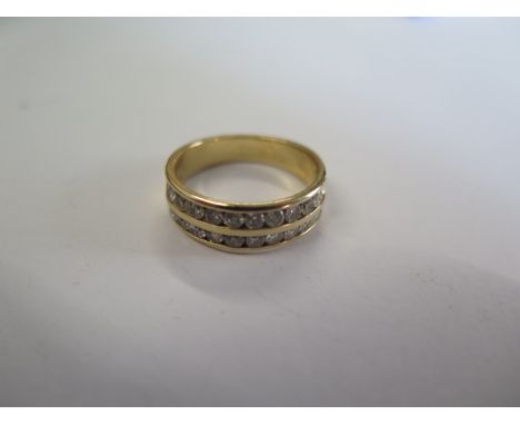 A 14ct yellow gold diamond two band ring approx weight 0.73ct - ring size M/N - approx weight 4.5 grams - good condition 