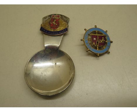 A Queen Mary enamel ships wheel badge and a caddy spoon 