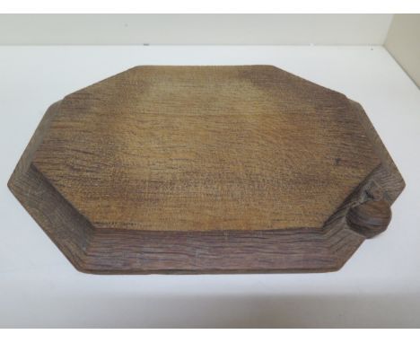 A Thompson Mouseman of Kilburn octagonal breadboard - 31cm x 25cm - no splits or cracks, some utensil marks 