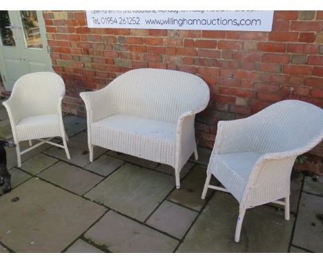 A Lloyd Loom sofa and two armchairs 