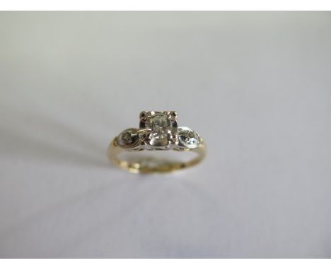 A 14ct yellow and white metal three stone diamond ring size M/N - approx weight 2 grams - generally good 