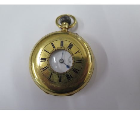 An 18ct yellow gold top wind half hunter pocket watch with 48.5mm case and gold dust cover approx. weight 96.5 grams - in run