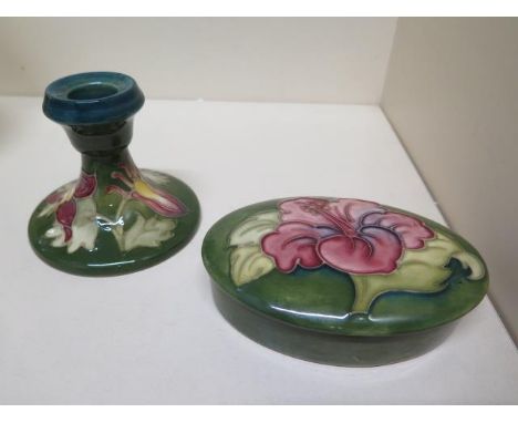 A Moorcroft green ground lidded pot - Width 13cm and a Moorcroft green ground candlestick - Height 8cm 