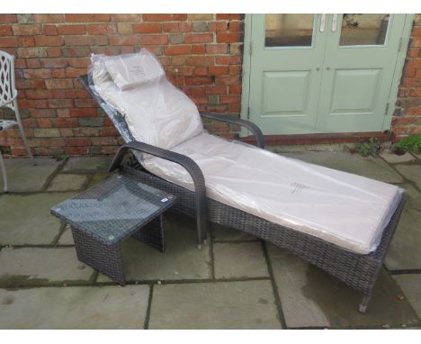 A new Maze Rattan Florida sun lounger with a drinks table - cheapest internet prince £279 - boxed 