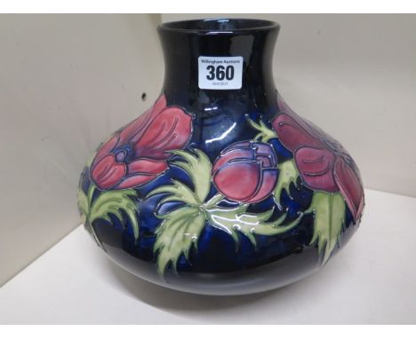 A large Moorcroft blue ground Anemone vase - Height 20cm - crazing to base, otherwise good condition 