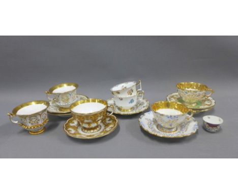 Collection of Dresden moulded and heavy gilded cups and saucers, most with blue crossed sword backstamps and a small porcelai