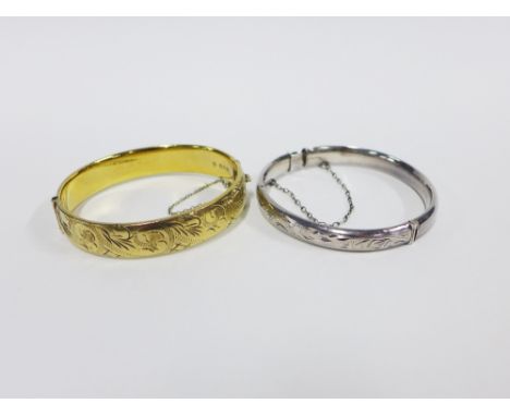 Vintage silver gilt stiff hinged bangle, London 1967, together with another with Birmingham 1977 hallmarks (2)   