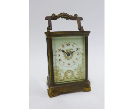 French brass cased carriage clock, the dial with Roman numerals and floral pattern, 15cm including handle 