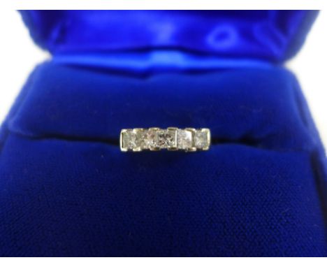 18ct white gold and diamond ring, set with a single row of five square diamonds, stamped 750, UK ring size K