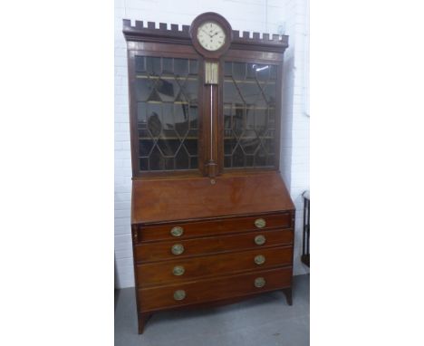 19th century bureau bookcase cabinet, with a crenuated  top enclosing a clock face and barometer flanked by astragal glazed c