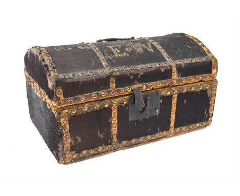 An 18th century brass studded ponyskin covered small travel trunk, the hinged domed top with iron lockplate enclosing a paper