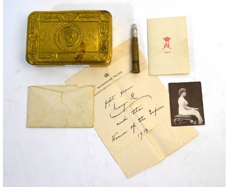 A WW I Queen Mary Christmas tin (1914) including envelope, card, photo portrait and slip