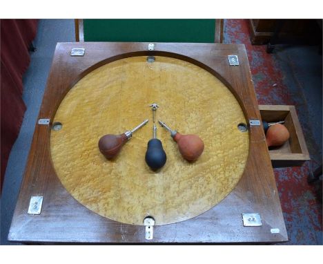 An early 20th century continental blow football/games table, the double sided baize lined top enclosong a burr maple playing 