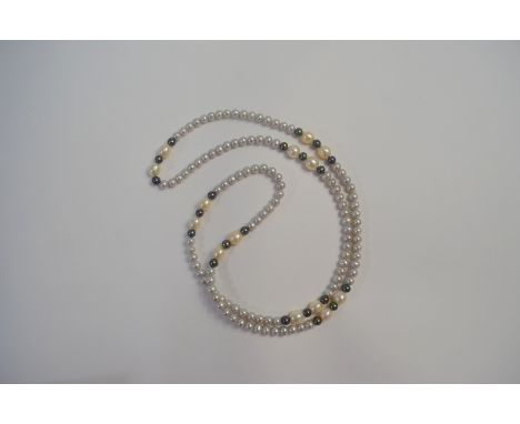 A cultured pearl necklace, the round pale grey pearls interspersed with circular black and oval white pearls