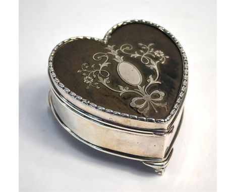 An Edwardian silver, tortoiseshell and piqué-work heart-shaped trinket box with hinged cover and velvet lining, on claw and b