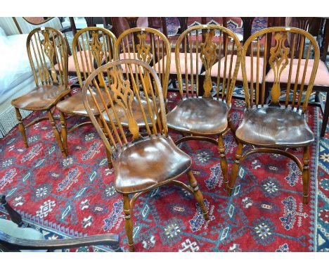 A set of six Windsor elm stick and hoop back side chairs, raised on crinoline stretchers (6)Good condition. &nbsp;Age - mid t