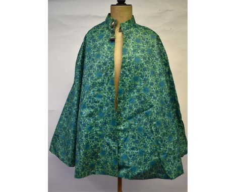 Miss Mayfair, 16 The Square, Winchester - A 1960s floral turquoise/green textured PVC cape with pale blue cotton lining and s