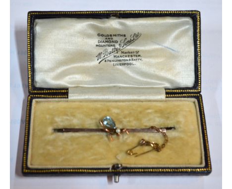 A rose metal bar brooch, set with central aquamarine and pearl set insect on knife edge bar, fitted with safety chain, in fit