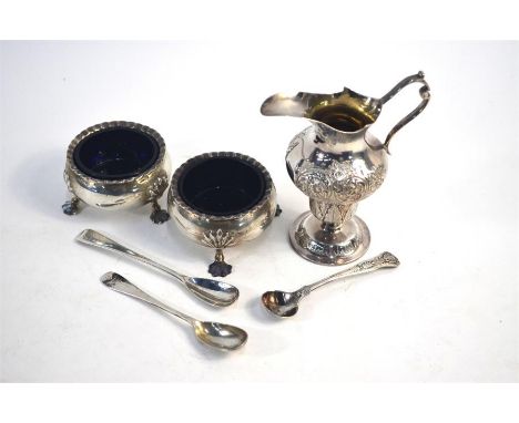 A late Victorian baluster cream jug in the Georgian manner, with foliate and scroll engraving and stemmed foot, James Dixon &