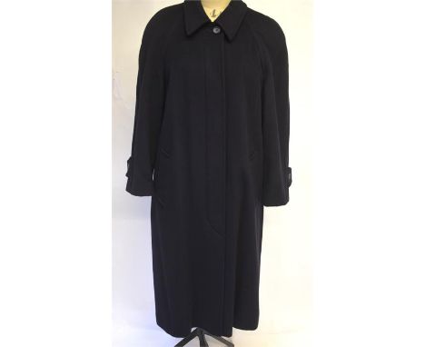 A lady's Selfridges 100 per cent cashmere navy blue full length coat lined with blue self-striped lining, concealed buttons a