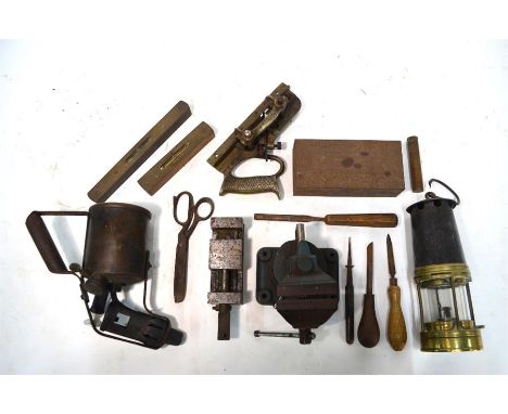 A vintage brass and tin miner's safety lamp stamped 'OKC 126' to/w various old tools including Optimus blow-torch, Record pla