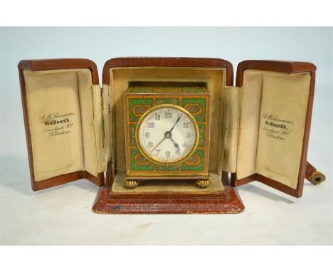 An Art Deco gilt metal and champlevee enamel travel clock with alarm, 6 cm high, in leather simulated crocodile display-caseT